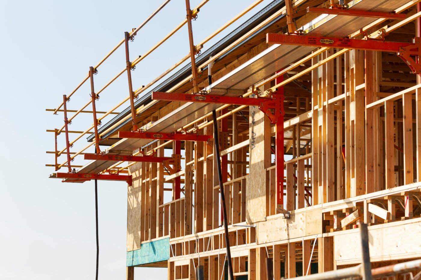 A partially constructed building covered in scaffold